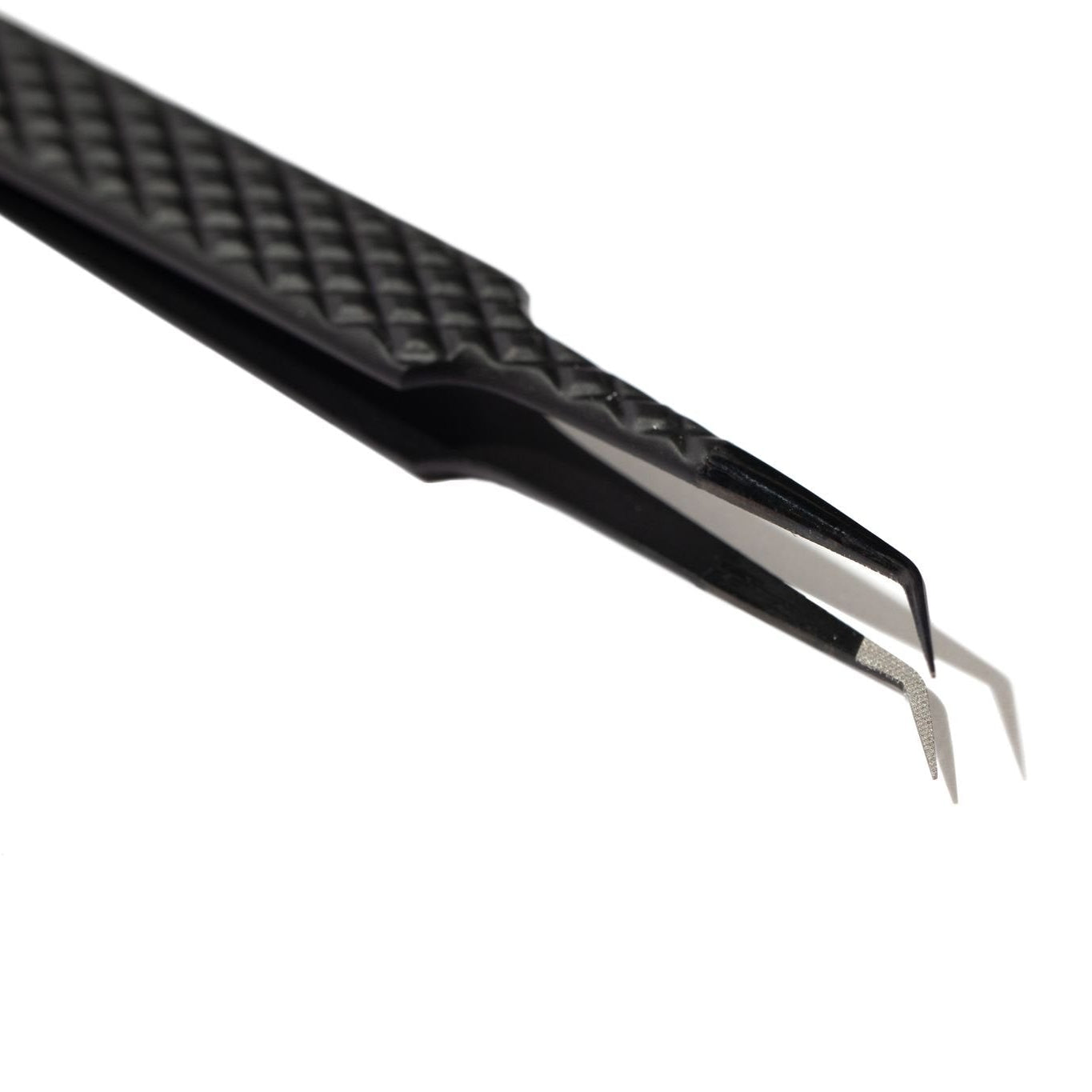 Close up detail of lash application tweezers