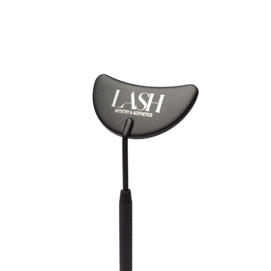 A black eyelash accessory with a crescent-shaped mirror with the word 'LASH' printed on it.